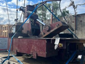 Portrait photo of a red used McIntyre Mantis Baler
